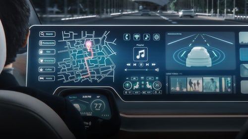 Interior view of a software-defined vehicle with a touchscreen dashboard and advanced electronic features